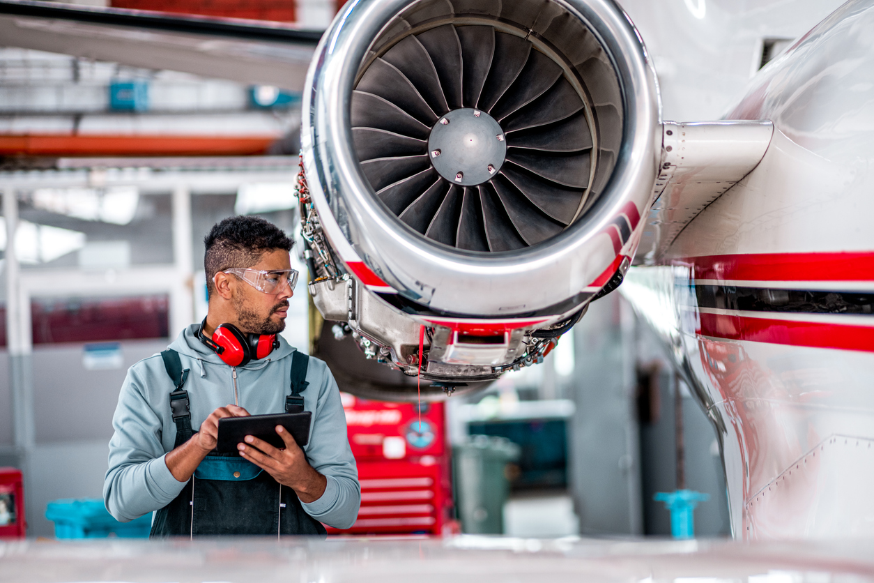 Aircraft maintenance operative viewng digital work instructions on a tablet computer
